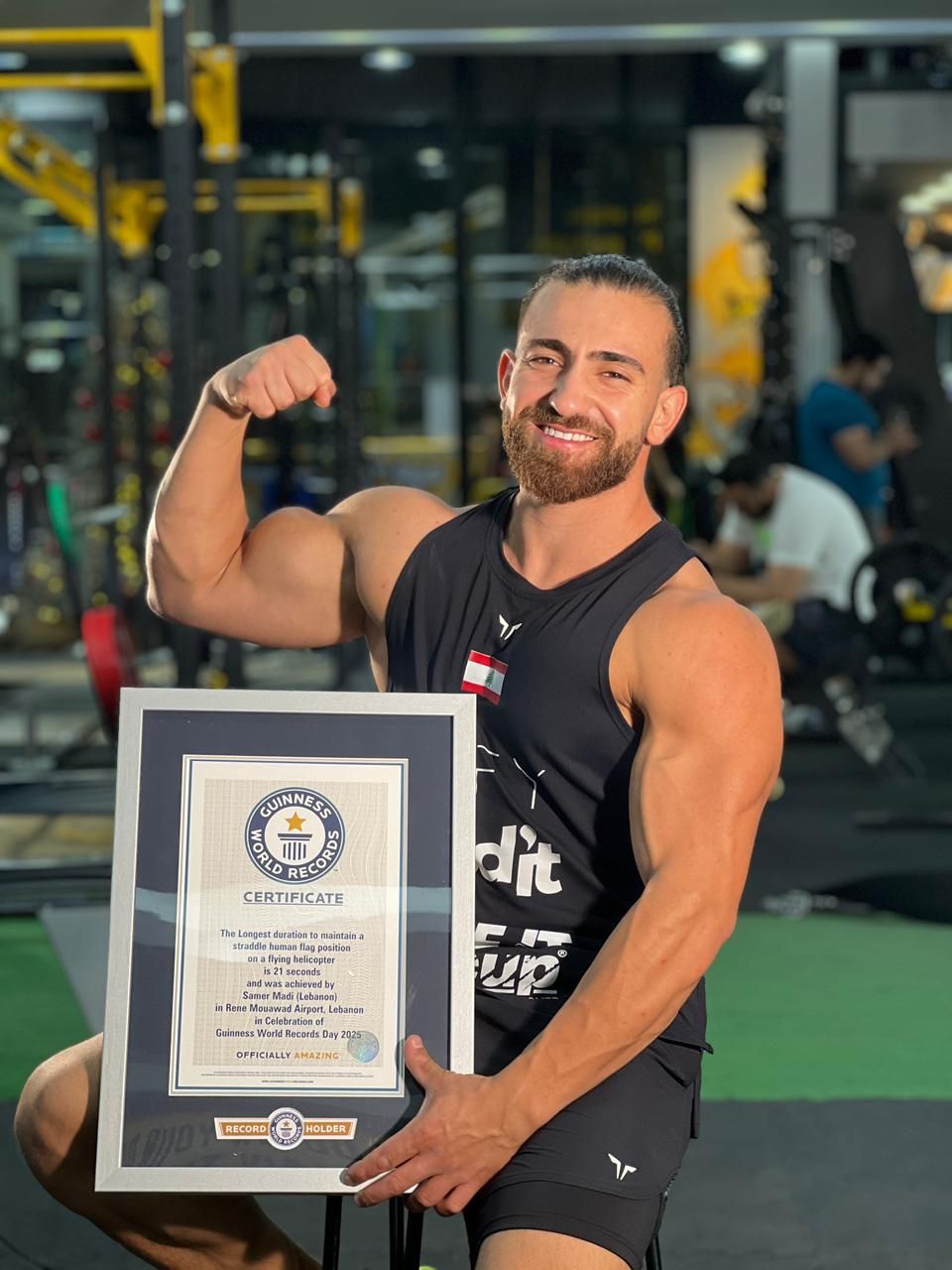 Samer Madi holding his Guinness World Records certificate