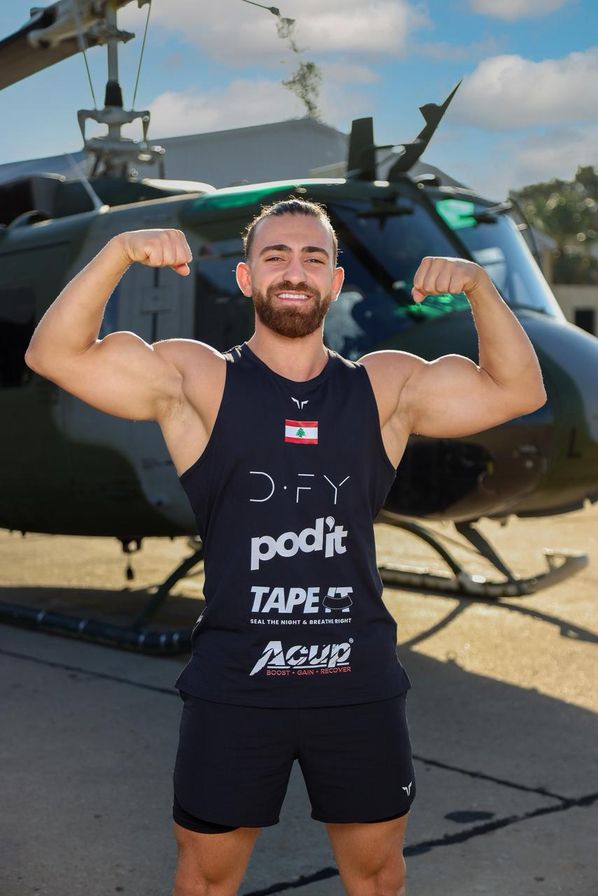 Samer flexing outdoors